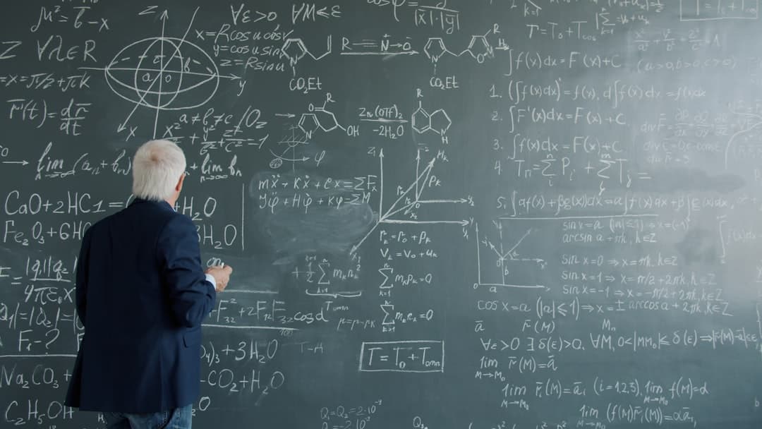 Teacher explaining to group of students